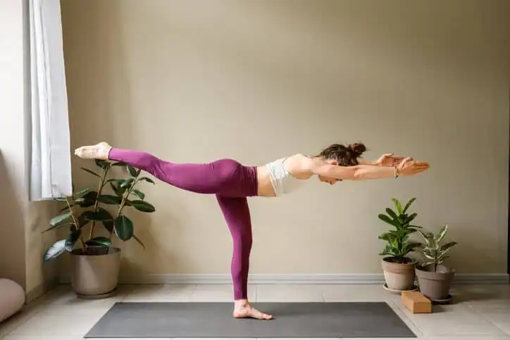 Woman doing Yoga exercise Folkestone to help with toning the body. 